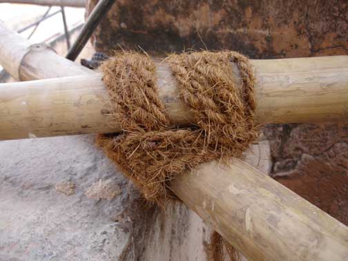 Close up of bamboo scaffolding tied with rope.
