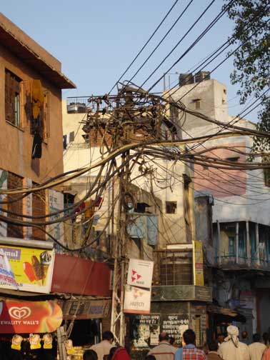 Twisted spider web of overhead electrical wires in Old Delhi.