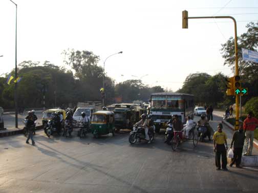 Traffic in Delhi at a stop light.