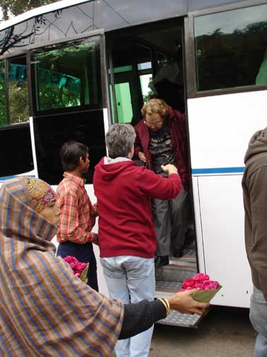 Hugh helping his mother exit the bus at Chandi Devi.