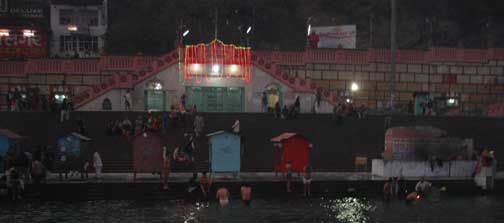 Men immersing themselves in the Ganges River.