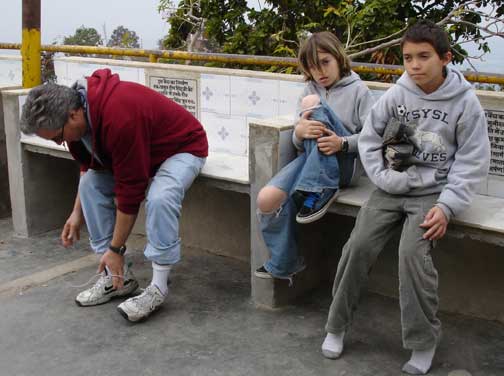 Hugh, Alex, and David put their shoes back on.