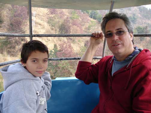 David and Hugh riding up the mountain to the temple.