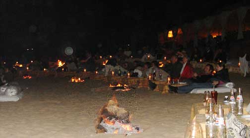 Guests sitting around campfires at Manwar Camp.