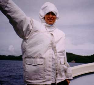 Eileen on boat in raincoat