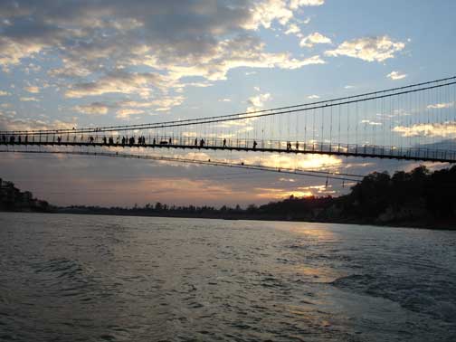 Bridge and sunset over Ganges River.