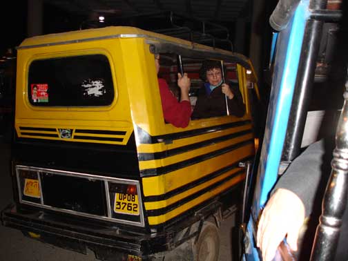 Auto rickshaw painted like a New York City taxi.
